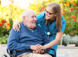 caregiver taking patient's blood pressure